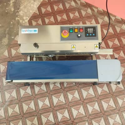 brother's sealing machine. . .