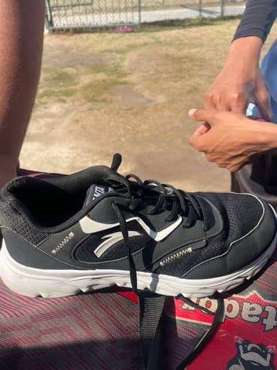 black Anta shoes and POPESC shoes