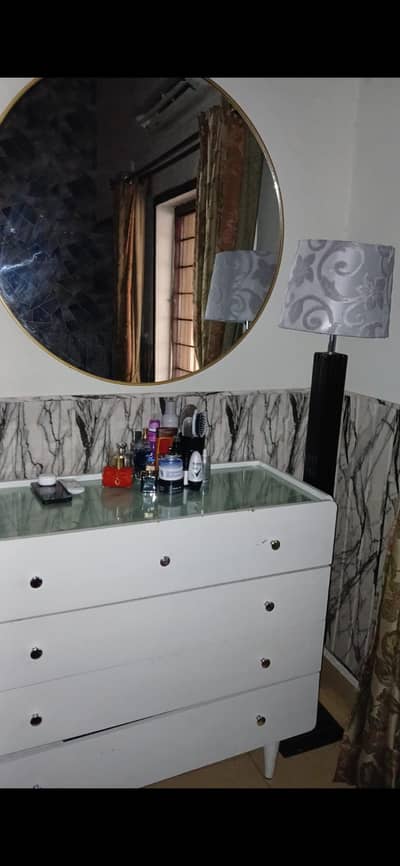 dressing table with round wall mirror