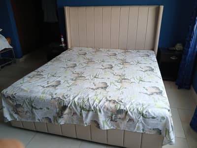 velvet upholstered bed set with padded headboard and side table