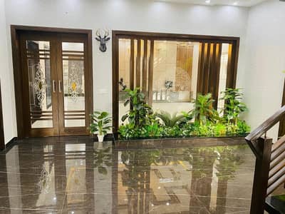 A BEAUTIFUL 1 KANAL SINGLE STORY HOUSE FOR RENT IN OVS B BAHRIA TOWN LAHORE