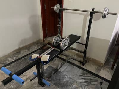 workout benche with dumbells and barbell with free Tummy Trimmer rare