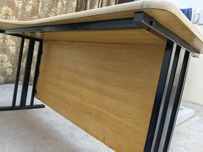 one tebel and 3 office chairs