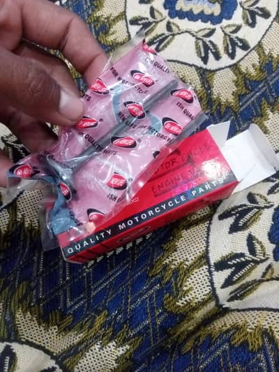 honda deluxe 125 original head valves.  brand new