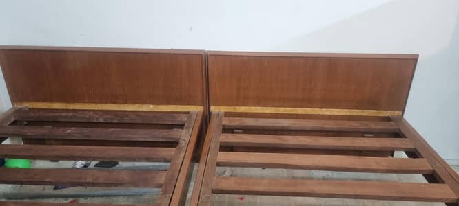 two single wooden beds