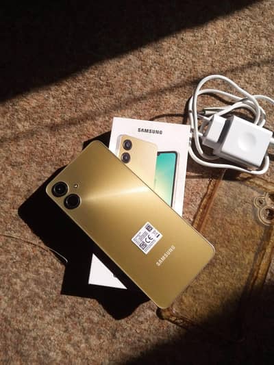 Samsung A06 with box and charger in warrantee  (03084384659)