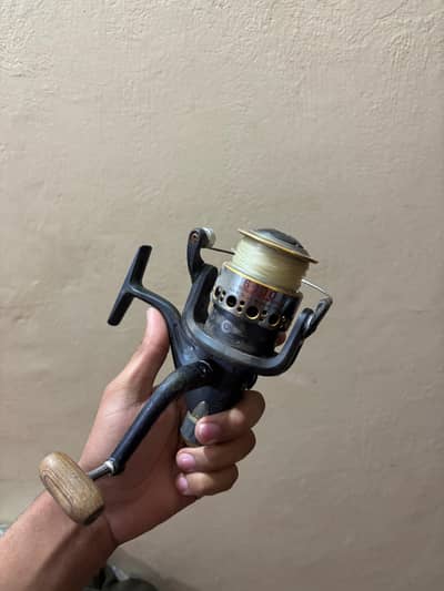 Spinning fishing reel, designed for freshwater or saltwater fishing.