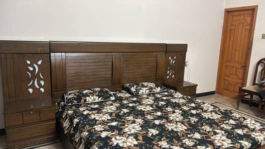 A new double bed with side tables in just 50000