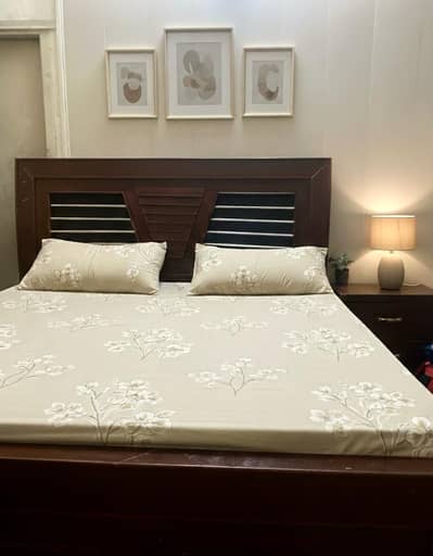 Bed with side tables and dressing table