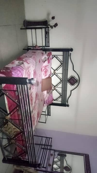iron bed with dressing table and side tables
