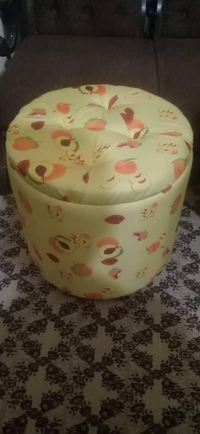 Two ottomans with one round table