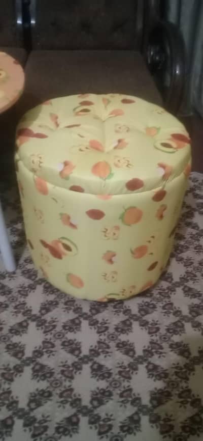 Two ottomans seat with one round table