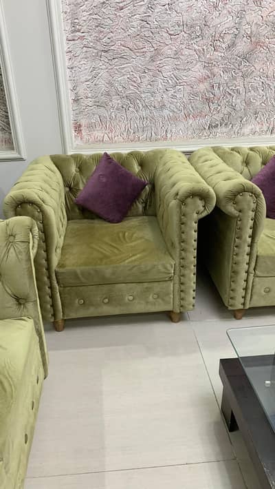 olive green sofa set with cushions