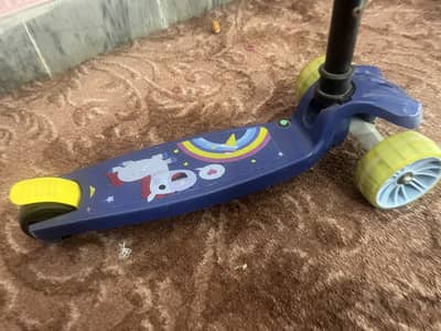 Kids scooty with light and music