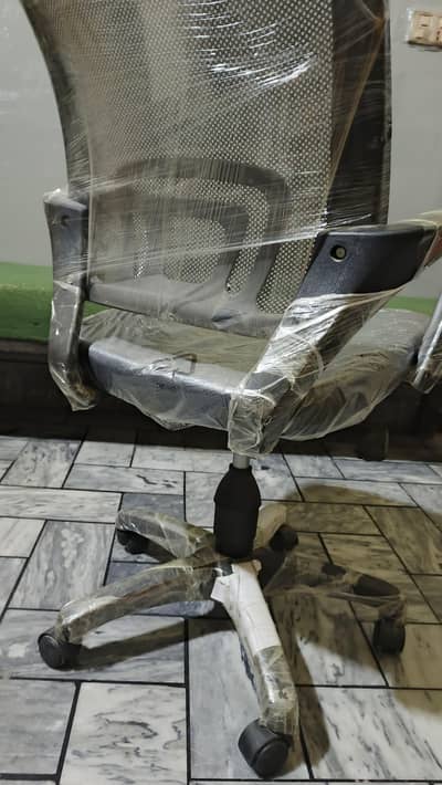 Revolving office table chair.