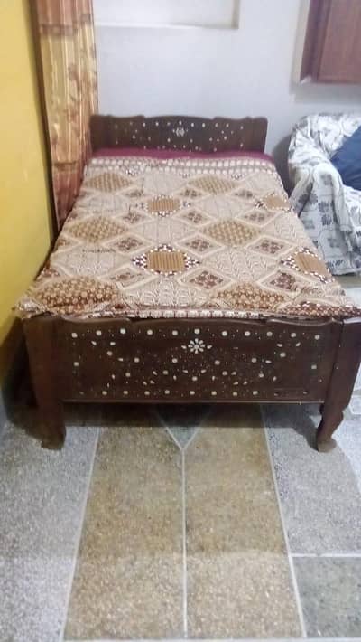 single wood bed without matters
