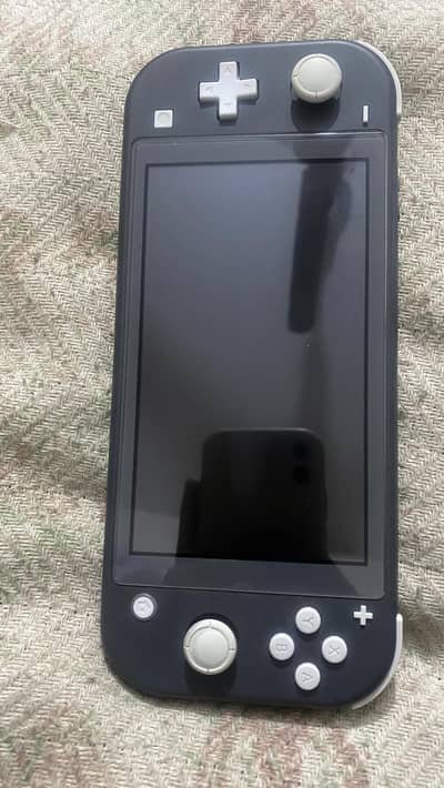  Nintendo Switch Lite Jailbreaked 10/10 – With Box – 7 Games- 45000