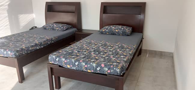 2 Wooden Single Beds with 2 Mattresses and 1 side table