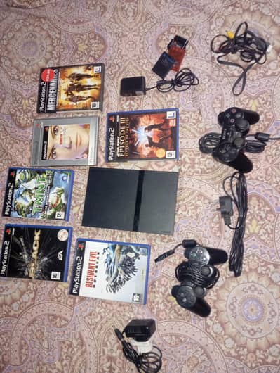Sony PS2 with all accessories,. new games box pack