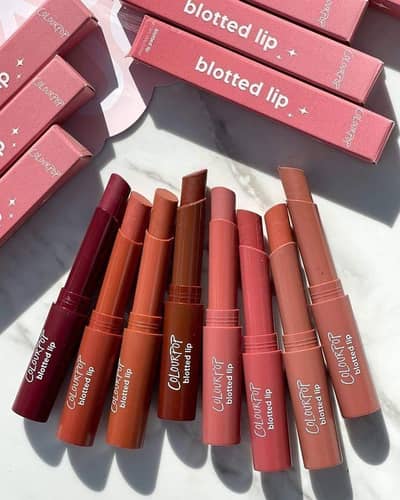 lipgloss in a beautiful pink shade with a smooth and creamy texture. .