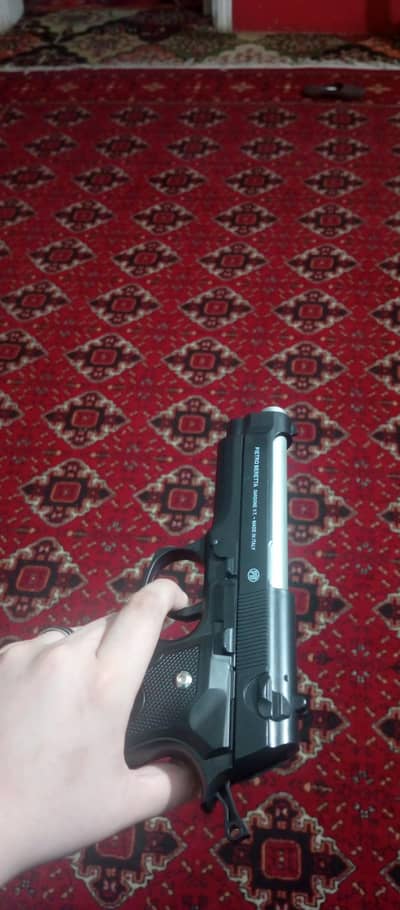 toy gun in matel barrel