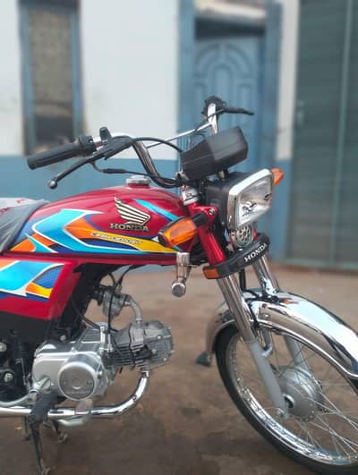 Honda CD 70 red colour 2026 applied