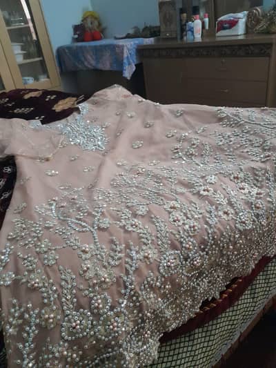 stone work short frock peach colour 