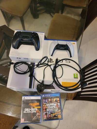 1 TB Disc Variant PS5 with all accessories and two games