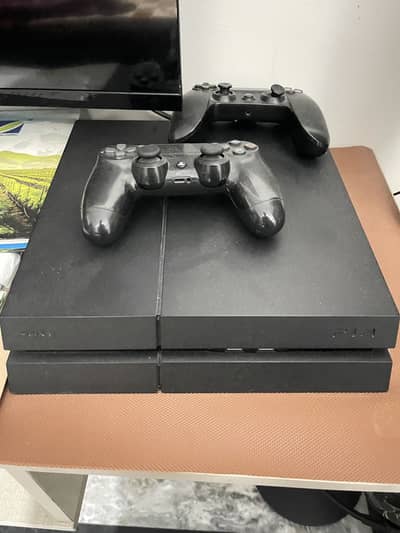 PS4 in good condition with two wireless controllers