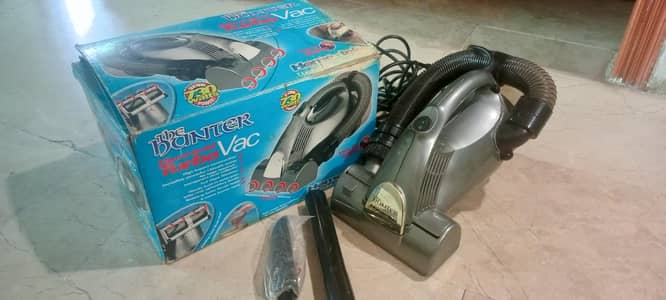 Hand held turbo vacuum