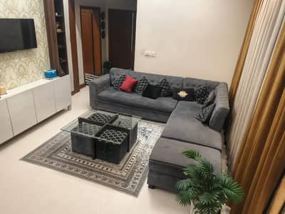 L shape sofa with table and stools