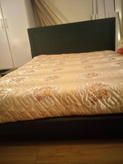 Quess size bed  (low bed) with side tables and  mattress.