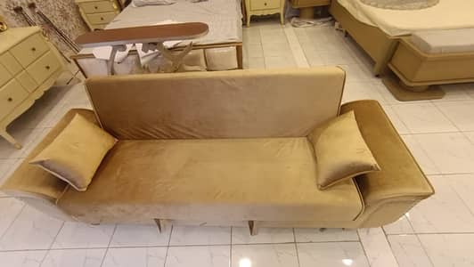 Beige Velvet sofa bed with pillows and Golden Velvet 3-seater sofa