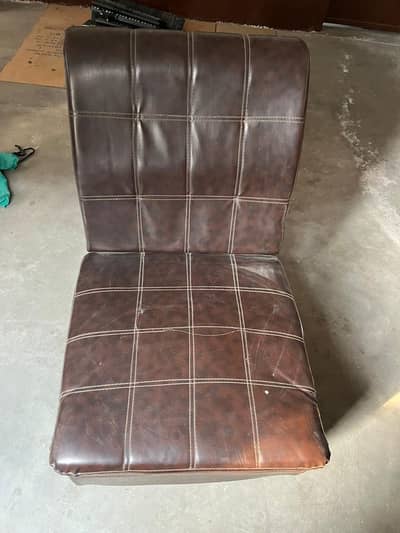 High-quality brown leather sofa chair available for sale.