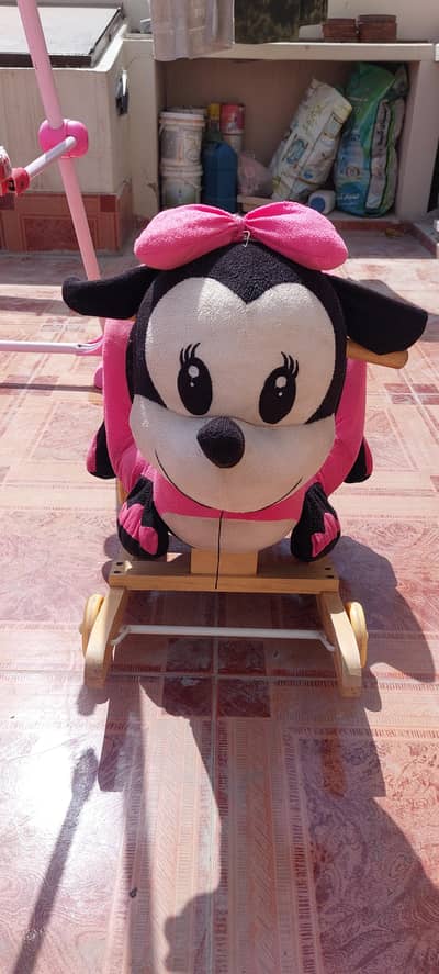 Baby Sewing and Rocking Micky