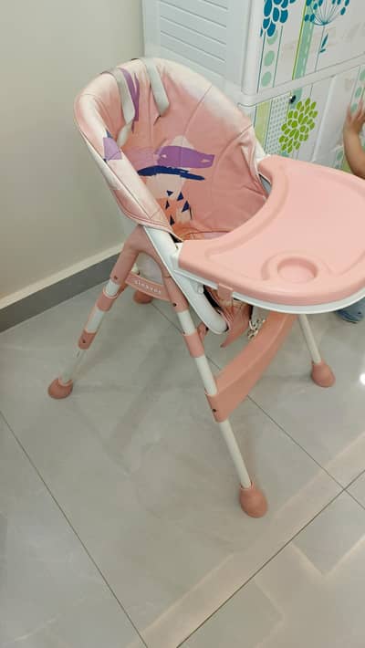 high chair pink in color just used for  1 year