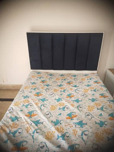 two single bed with 1 side table