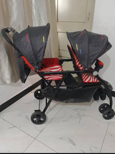 Twin branded pram stroller for sale