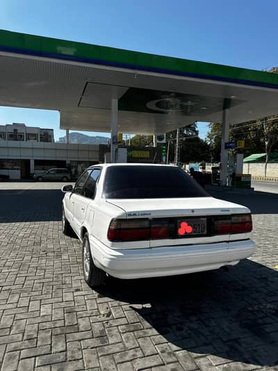 toyota Corolla SE saloon 1988 maroon enterior