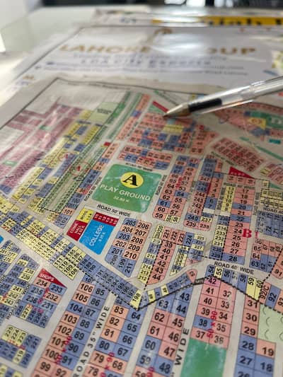 1 Kanal Plot Available For Sale, Ideally Located Near Park And Mosque, With Excellent 150 Feet Wide Main Road Access.