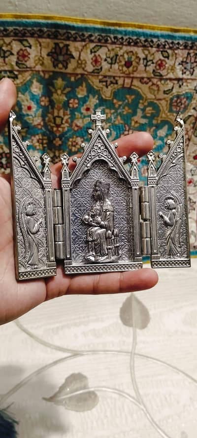 Religious triptych, often used as a portable shrine or travel altar.