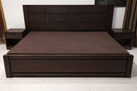 wooden bed with two side tables