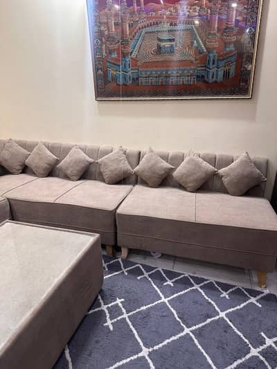 L shaped sofa with center table
