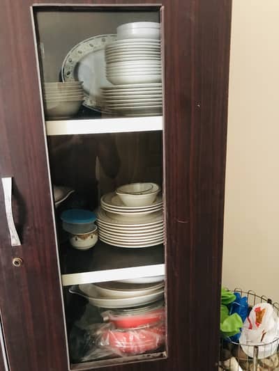 Cupboard for kitchen items and crockery
