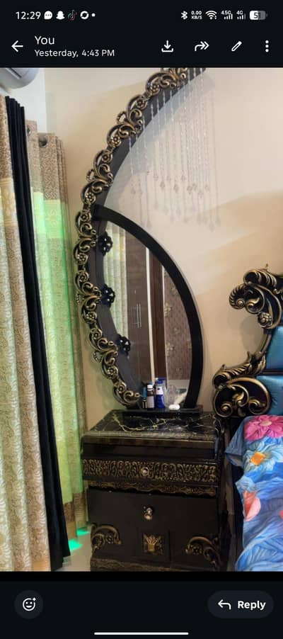 luxury bed with stylish side tables and dressing.