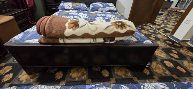 double bed with mattress and side tables