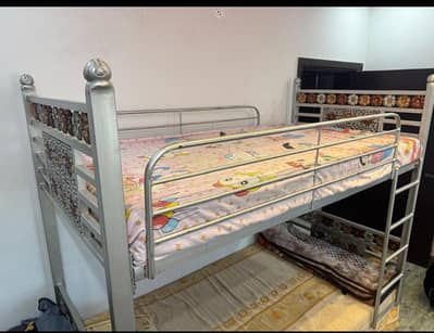 Almost New Heavy gauge rot iron Bunk bed with Mattresses