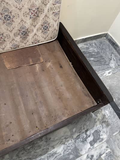 Wooden single bed for sale.