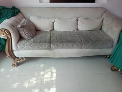 white / golden sofas.