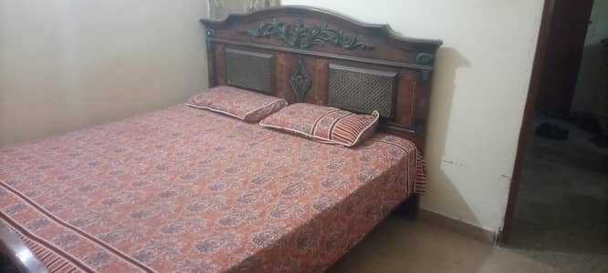 Wooden double bed and dresser